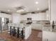 Bright kitchen features a large center island, stainless steel appliances, and modern lighting at 2361 Hanover Woods Rd, Lithonia, GA 30058