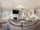 Spacious living room features a fireplace, built-in shelving, and decor at 2361 Hanover Woods Rd, Lithonia, GA 30058