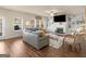 Inviting living room features a fireplace, built-in shelving, and large windows at 2361 Hanover Woods Rd, Lithonia, GA 30058