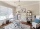 Home office features a light fixture, window with blinds, and modern decor at 2361 Hanover Woods Rd, Lithonia, GA 30058
