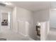 Upstairs hallway with carpeted floors leading to secondary rooms at 2361 Hanover Woods Rd, Lithonia, GA 30058