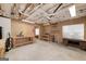Spacious unfinished basement with work tables and shelves, ready for hobby or storage at 408 Tomahawk Trl, Mcdonough, GA 30252