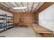 Unfinished basement with organized shelving, work table, and room for storage or hobbies at 408 Tomahawk Trl, Mcdonough, GA 30252