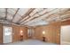 Unfinished basement space with insulated ceiling, door to outside, and bright lighting at 408 Tomahawk Trl, Mcdonough, GA 30252
