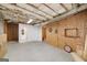 Unfinished basement showing open layout and access to bathroom, ready for renovation at 408 Tomahawk Trl, Mcdonough, GA 30252