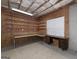 Spacious basement area with workshop benches and shelving offers potential for customization and storage at 408 Tomahawk Trl, Mcdonough, GA 30252