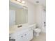 This full bathroom includes a tile floor, a white sink and vanity, and a shower with tile surround at 408 Tomahawk Trl, Mcdonough, GA 30252