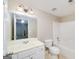 Bright bathroom with a vanity sink, toilet, and a bathtub-shower combination at 408 Tomahawk Trl, Mcdonough, GA 30252