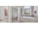 Bathroom with shower, tub, and large window at 408 Tomahawk Trl, Mcdonough, GA 30252