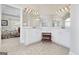 Bright bathroom with double vanity, sconces, and tile flooring at 408 Tomahawk Trl, Mcdonough, GA 30252