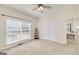 Bright bedroom features a ceiling fan, window with blinds, and a convenient closet for storage at 408 Tomahawk Trl, Mcdonough, GA 30252