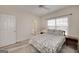 Well-lit bedroom boasts a cozy bed, window views, and easy access to the adjacent bathroom at 408 Tomahawk Trl, Mcdonough, GA 30252