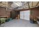Attached garage with ample space for parking and extra storage, insulated ceiling at 408 Tomahawk Trl, Mcdonough, GA 30252