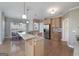Well-lit kitchen featuring stainless steel appliances, a large island, and a breakfast nook at 408 Tomahawk Trl, Mcdonough, GA 30252