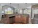 Modern kitchen with stainless steel appliances, granite counters, and a view to the yard at 408 Tomahawk Trl, Mcdonough, GA 30252