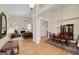 Open-concept living space featuring elegant columns, hardwood floors, fireplace, and ample natural light at 408 Tomahawk Trl, Mcdonough, GA 30252