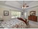 Bright primary bedroom features a ceiling fan and ensuite at 408 Tomahawk Trl, Mcdonough, GA 30252