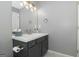Modern half-bathroom featuring a stylish vanity, vanity lights, and modern fixtures at 1383 Dolcetto Nw Trce # 9, Kennesaw, GA 30152