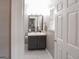 Clean bathroom featuring a modern vanity, stylish mirror, and a tiled floor at 1383 Dolcetto Nw Trce # 9, Kennesaw, GA 30152