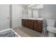 Bright bathroom with double sink vanity, neutral paint, and tiled flooring at 1383 Dolcetto Nw Trce # 9, Kennesaw, GA 30152