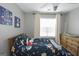 Bright bedroom with space decor, ceiling fan, and natural light from the window at 1383 Dolcetto Nw Trce # 9, Kennesaw, GA 30152