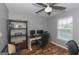 Bedroom featuring a wooden floor, ceiling fan, desk, and shelving unit at 1383 Dolcetto Nw Trce # 9, Kennesaw, GA 30152