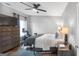 Relaxing bedroom features a ceiling fan, tv on dresser, and neutral decor at 1383 Dolcetto Nw Trce # 9, Kennesaw, GA 30152