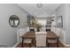 Elegant dining area with seating for four, adjacent to a modern kitchen at 1383 Dolcetto Nw Trce # 9, Kennesaw, GA 30152
