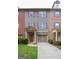 Charming townhome with a brick and gray exterior, complete with a one car garage and colorful shutters at 1383 Dolcetto Nw Trce # 9, Kennesaw, GA 30152