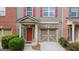 Charming townhome with a brick and gray exterior, complete with a one car garage and colorful shutters at 1383 Dolcetto Nw Trce # 9, Kennesaw, GA 30152