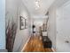 Bright hallway with stairs, hardwood floors, neutral walls, and modern track lighting, creating a welcoming entrance at 1383 Dolcetto Nw Trce # 9, Kennesaw, GA 30152