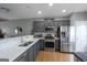 Updated kitchen with stainless steel appliances, granite countertops, and hardwood flooring at 1383 Dolcetto Nw Trce # 9, Kennesaw, GA 30152