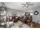 Open-concept living room with hardwood floors, gray walls, stylish furniture, and seamless access to the dining area at 1383 Dolcetto Nw Trce # 9, Kennesaw, GA 30152