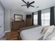 Serene main bedroom with a ceiling fan, dresser with tv, and plenty of natural light at 1383 Dolcetto Nw Trce # 9, Kennesaw, GA 30152