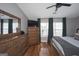 Spacious main bedroom featuring a large dresser, mounted tv, and natural light at 1383 Dolcetto Nw Trce # 9, Kennesaw, GA 30152