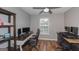Functional office space with modern desks, chairs, ceiling fan, and plenty of natural light at 1383 Dolcetto Nw Trce # 9, Kennesaw, GA 30152