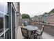 Back deck features outdoor seating area with table, chairs, and grill at 1383 Dolcetto Nw Trce # 9, Kennesaw, GA 30152