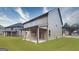 Backyard view showcasing a covered patio and well-maintained lawn, great for outdoor enjoyment at 1716 Goodwin Dr, Hampton, GA 30228