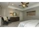 Comfortable bedroom featuring tray ceilings, a ceiling fan, neutral tones, and modern decor at 1716 Goodwin Dr, Hampton, GA 30228