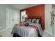 Bright bedroom features sporty decorations, an expansive window, and a calming color palette at 1716 Goodwin Dr, Hampton, GA 30228
