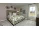 Bedroom with a comfortable bed, soft carpeting, large window, and soothing wall art at 1716 Goodwin Dr, Hampton, GA 30228
