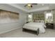 Bright bedroom features large window, a carpeted floor and a mirrored headboard above the plush bed at 1716 Goodwin Dr, Hampton, GA 30228
