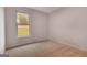 Vacant bedroom with neutral paint and carpet with window overlooking yard at 1716 Goodwin Dr, Hampton, GA 30228