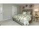 Bedroom with a comfortable bed, soft carpeting, and stylish wall decorations at 1716 Goodwin Dr, Hampton, GA 30228