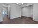 A spacious dining room features hardwood floors, modern lighting, and views of the outdoors at 1716 Goodwin Dr, Hampton, GA 30228