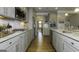 Well-equipped kitchen with granite countertops, stainless steel appliances and hardwood floors at 1716 Goodwin Dr, Hampton, GA 30228