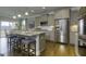 Bright kitchen with stainless steel appliances, center island and hardwood flooring at 1716 Goodwin Dr, Hampton, GA 30228