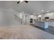 Open-concept living space featuring a staircase and an eat-in kitchen at 1716 Goodwin Dr, Hampton, GA 30228
