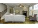 Comfortable living room with a stone fireplace, hardwood floors, and neutral decor at 1716 Goodwin Dr, Hampton, GA 30228