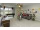 An entertainment room with a stylish couch, a sleek TV, and playful accents offers relaxation at 1716 Goodwin Dr, Hampton, GA 30228